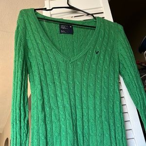 American Eagle green sweater.